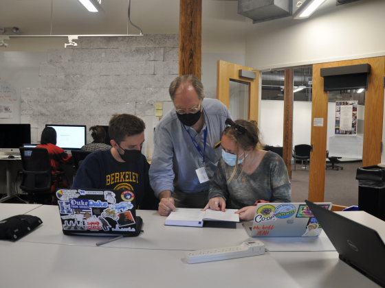 Lee Sorensen and students, Paul Kramer and Eleanor Ross, working on an entry in the Wired! lab