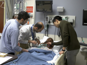Kevin and mentors working on a model patient